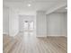 Bright, airy living room with modern flooring and access to the outdoor deck at 2530 Sunset Dr, Largo, FL 33770