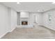 Bright living room with a stone fireplace, wood flooring, and recessed lighting at 2530 Sunset Dr, Largo, FL 33770