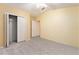 Empty bedroom with neutral carpet and a closet at 2611 Brookville Dr, Valrico, FL 33596