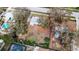Aerial view of single story home with large lot surrounded by mature trees in a residential neighborhood at 2832 W Bay Haven Dr, Tampa, FL 33611