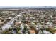 A picturesque aerial view of the home surrounded by lush greenery in a well-established neighborhood with mature trees at 2832 W Bay Haven Dr, Tampa, FL 33611