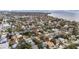 An aerial view of a cozy neighborhood, featuring the property nestled among mature trees, highlighting its desirable location at 2832 W Bay Haven Dr, Tampa, FL 33611