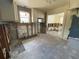 Kitchen view shows cabinets, a microwave, and framework connecting to an adjacent room under renovation at 2832 W Bay Haven Dr, Tampa, FL 33611