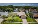 Aerial view of the home showcasing its landscaping and roof in a residential neighborhood at 3350 Brian N Rd, Palm Harbor, FL 34685