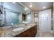 Bathroom featuring granite countertops, double sinks, and modern fixtures offering a spa-like experience at 3350 Brian N Rd, Palm Harbor, FL 34685