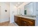 Elegant bathroom with double sinks, granite countertops, wood cabinets, and ample counter space at 3350 Brian N Rd, Palm Harbor, FL 34685