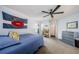 Bedroom with a large banner on the wall, soft carpet, and access to the hallway at 3350 Brian N Rd, Palm Harbor, FL 34685