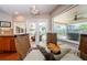 Charming breakfast nook with views of the pool and patio area, ideal for relaxed dining at 3350 Brian N Rd, Palm Harbor, FL 34685