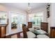 Cozy breakfast nook with pool views, offering a perfect spot for morning coffee or casual meals at 3350 Brian N Rd, Palm Harbor, FL 34685