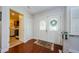 Bright foyer featuring hardwood floors, a decorative front door, and access to other rooms at 3350 Brian N Rd, Palm Harbor, FL 34685