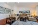 Inviting living room with comfortable sectional sofa and stylish decor details on a patterned rug at 3350 Brian N Rd, Palm Harbor, FL 34685