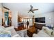 Inviting living room featuring wood floors, comfortable seating, and an open layout to the kitchen at 3350 Brian N Rd, Palm Harbor, FL 34685