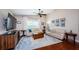 Bright living room with comfortable seating, a ceiling fan, and natural light at 3350 Brian N Rd, Palm Harbor, FL 34685