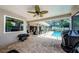 Spacious patio area with a clear view of the pool, perfect for outdoor relaxation and entertainment at 3350 Brian N Rd, Palm Harbor, FL 34685