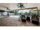 Covered patio area that is perfect for lounging with a view of the pool and backyard at 3350 Brian N Rd, Palm Harbor, FL 34685