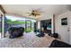 Inviting covered patio with plenty of room for outdoor activities with access to the beautiful pool at 3350 Brian N Rd, Palm Harbor, FL 34685