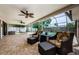 Relaxing covered patio with comfortable seating, offering an ideal space for enjoying poolside views and leisure at 3350 Brian N Rd, Palm Harbor, FL 34685
