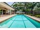 Enjoy the shimmering screened pool, brick pavers, and tropical landscaping at 3350 Brian N Rd, Palm Harbor, FL 34685
