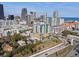 Aerial view showcasing modern apartments with city and ocean views, near coastal highways and urban amenities at 400 4Th S Ave # 704, St Petersburg, FL 33701