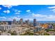 Aerial view showcasing city buildings and waterfront with a clear blue sky and scattered clouds at 400 4Th S Ave # 704, St Petersburg, FL 33701