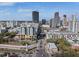 Cityscape featuring modern buildings along a tree-lined street with vehicle traffic, reflecting a thriving urban lifestyle at 400 4Th S Ave # 704, St Petersburg, FL 33701