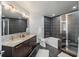 Modern bathroom with dual sinks, marble countertop, and a sleek tiled shower and tub at 400 4Th S Ave # 704, St Petersburg, FL 33701