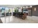 Bright common area with a large table with chairs, and large sliding doors leading to the outdoor pool area at 400 4Th S Ave # 704, St Petersburg, FL 33701