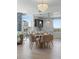 Chic dining area with a modern chandelier, seamlessly connecting to the kitchen and enhancing the open layout at 400 4Th S Ave # 704, St Petersburg, FL 33701