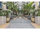 Inviting entrance to the building featuring lush landscaping and tranquil fountain at 400 4Th S Ave # 704, St Petersburg, FL 33701