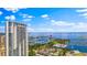 Striking exterior view features a high-rise residential building with a marina and waterfront in the background at 400 4Th S Ave # 704, St Petersburg, FL 33701