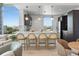 Modern kitchen with a breakfast bar and stylish pendant lighting, designed for both functionality and aesthetic appeal at 400 4Th S Ave # 704, St Petersburg, FL 33701