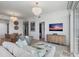 Bright, open living room with modern decor and comfortable seating near the dining area at 400 4Th S Ave # 704, St Petersburg, FL 33701