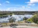 Overhead view of a scenic pond surrounded by lush greenery, walking paths, and natural beauty at 4016 Cadence Loop, Land O Lakes, FL 34638