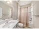 Clean bathroom with tiled shower, neutral color palette, and modern fixtures at 4016 Cadence Loop, Land O Lakes, FL 34638