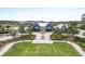 Stunning community clubhouse with manicured landscaping, seating area, and charming architectural details at 4016 Cadence Loop, Land O Lakes, FL 34638