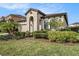 Inviting single-Gathering home featuring a well-maintained lawn and stylish front entrance at 4016 Cadence Loop, Land O Lakes, FL 34638
