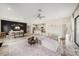 Spacious open floor plan featuring the living room, kitchen, and dining area, perfect for entertaining at 4016 Cadence Loop, Land O Lakes, FL 34638