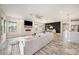 Open concept living area with fireplace, dining area, and kitchen featuring modern finishes and great natural light at 4016 Cadence Loop, Land O Lakes, FL 34638