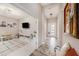 Bright living space connecting to the hallway, featuring a TV and lots of space for children to play at 4016 Cadence Loop, Land O Lakes, FL 34638