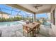 Relaxing screened-in patio with an outdoor dining area and a view of the backyard pool at 4016 Cadence Loop, Land O Lakes, FL 34638
