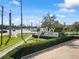 Street view of the Bexley community entrance with vibrant landscaping and clear signage for easy navigation at 4016 Cadence Loop, Land O Lakes, FL 34638