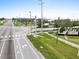 Street view featuring the Bexley community sign and well-maintained landscaping along a roadway at 4016 Cadence Loop, Land O Lakes, FL 34638