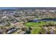 High aerial view of a golf course neighborhood with ponds, trees, and homes, showcasing the community's layout at 4100 Narvarez S Way, St Petersburg, FL 33712
