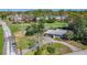 Aerial view of a house on a golf course, highlighting its location, landscaping and proximity to the green at 4100 Narvarez S Way, St Petersburg, FL 33712