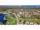 Beautiful aerial view of a golf course community with tree-lined streets, waterways, and residential homes at 4100 Narvarez S Way, St Petersburg, FL 33712