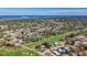 Expansive aerial view of a community near a lush golf course, showcasing the tranquil residential neighborhood at 4100 Narvarez S Way, St Petersburg, FL 33712