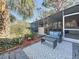 Charming back porch with comfortable seating and a patterned rug, offering a serene outdoor retreat at 4100 Narvarez S Way, St Petersburg, FL 33712