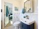 Bathroom features a modern sink, updated fixtures, and a view into the adjacent bedroom at 4100 Narvarez S Way, St Petersburg, FL 33712