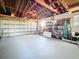 Spacious garage with ample storage shelving, offering room for vehicles and organizational projects at 4100 Narvarez S Way, St Petersburg, FL 33712