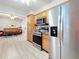 Kitchen featuring stainless steel appliances, wood cabinets and view to the living room at 4100 Narvarez S Way, St Petersburg, FL 33712